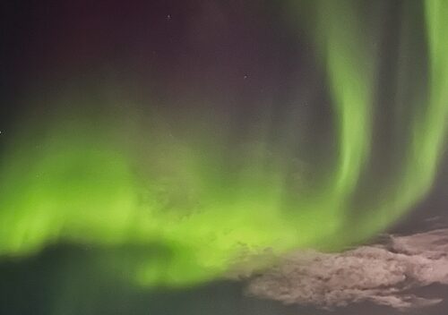 photo of someone watching northern lights