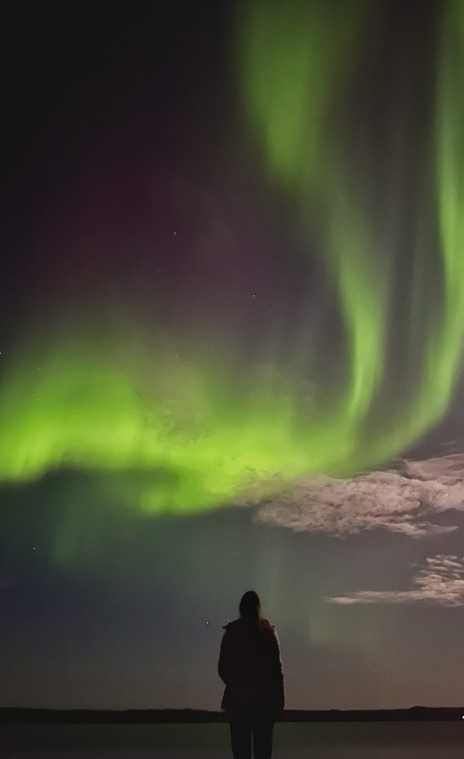 photo of someone watching northern lights