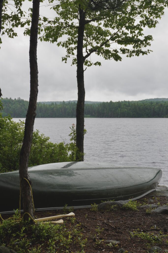 campsite views of a canoe and the lake